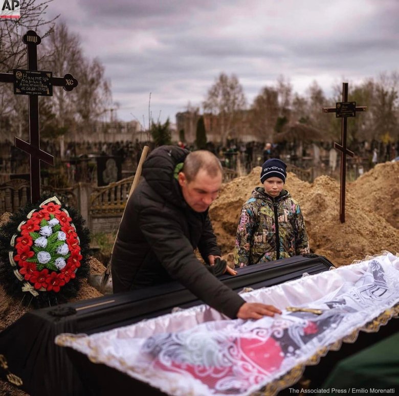 10-year-old Vova at funeral of his mother Marina, killed by Russian occupiers in Bucha 03