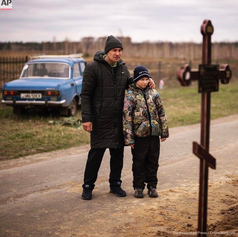 10-year-old Vova at funeral of his mother Marina, killed by Russian occupiers in Bucha 04